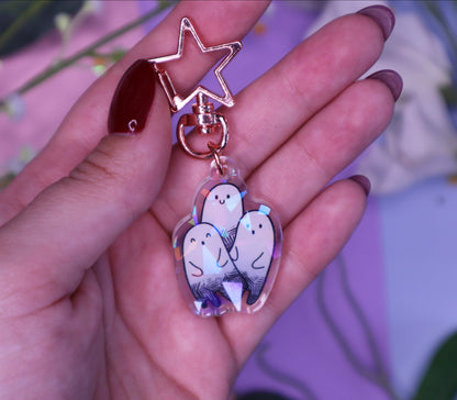 Ghost Trio Holographic Charm